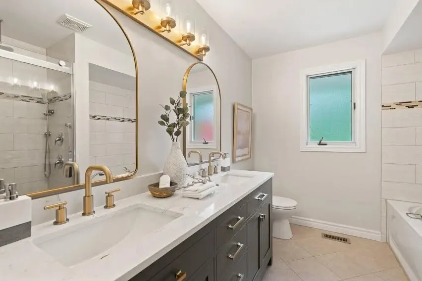 Renovated bathroom with brass fixtures